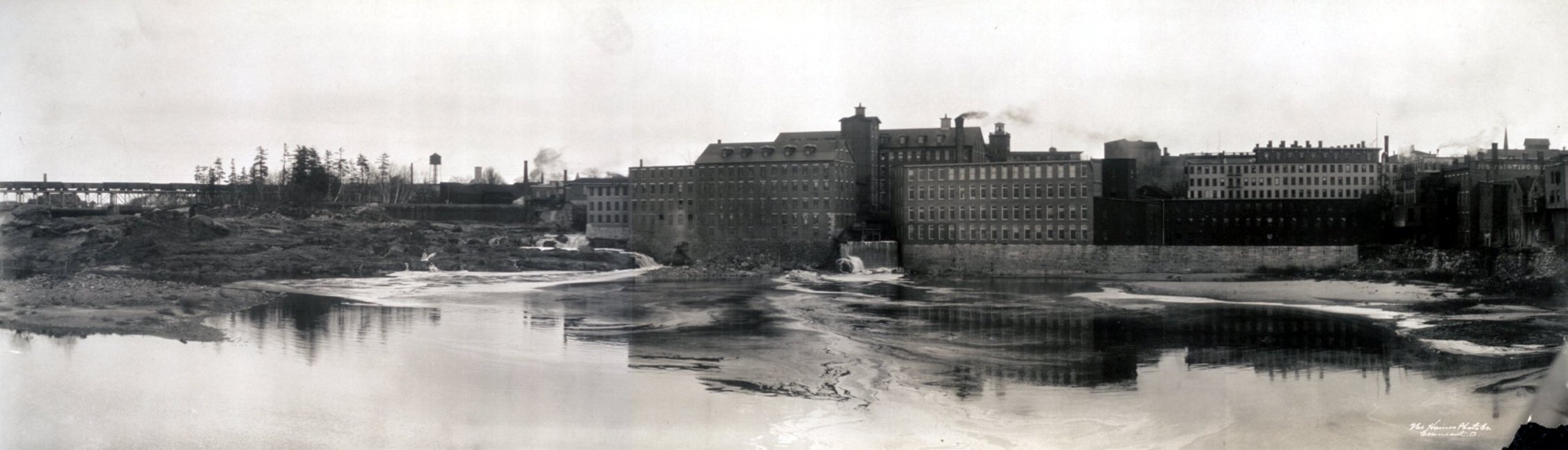 This is an historical panorama of the mills of Lewiston, Maine that sit on the Androscoggin River.